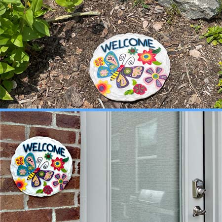 decorative stepping stone featuring a colorful butterfly design, suitable for placing in a garden pathway or hanging on a wall or fence.