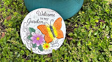 Orange butterfly garden stepping stone with a warm "Welcome to My Garden" message.